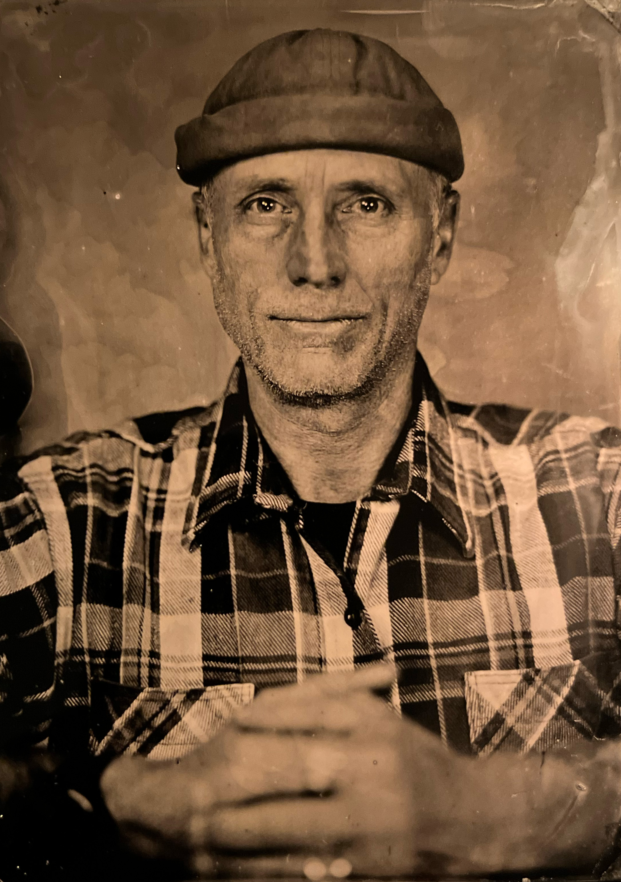 Paul Lebel in a cap photo on tin type traditional photograph in grey